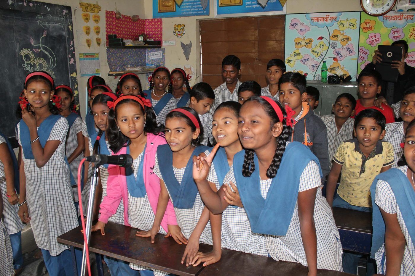 Girls reciting together in a rural classroom.